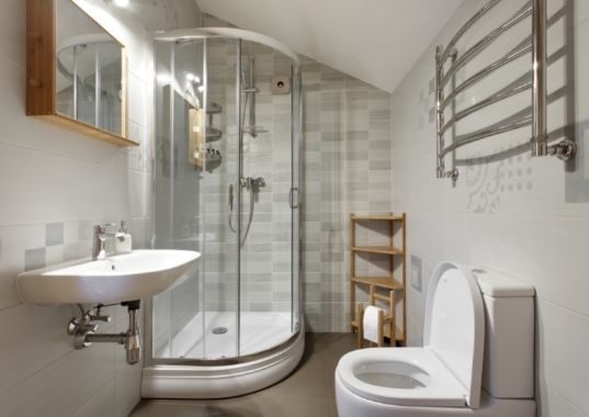 Finished bathroom renovation with tiled walls and modern fixtures