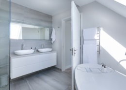 Modern renovated bathroom with new fixtures and tiling
