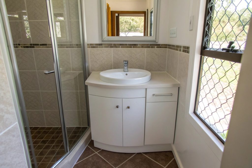 Space-saving corner vanity installed in compact Hobart ensuite