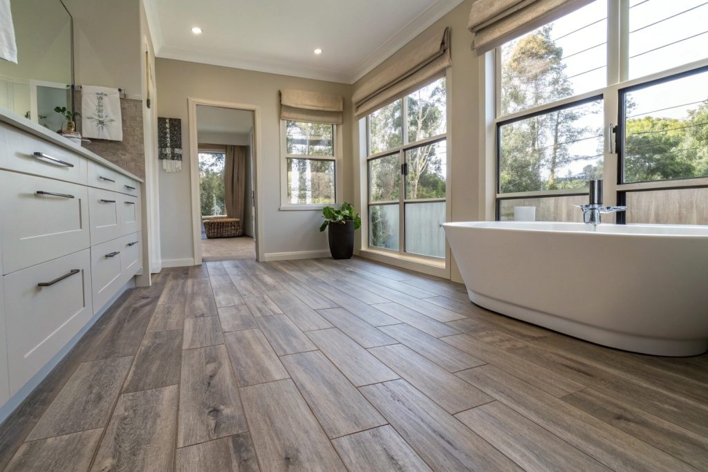 Wood-look plank floor tiles in contemporary Hobart bathroom