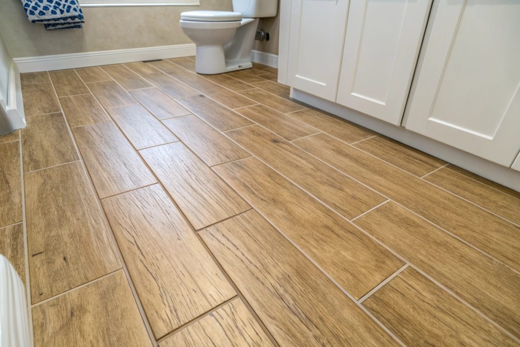 Wood-look porcelain floor tiles in modern bathroom renovation