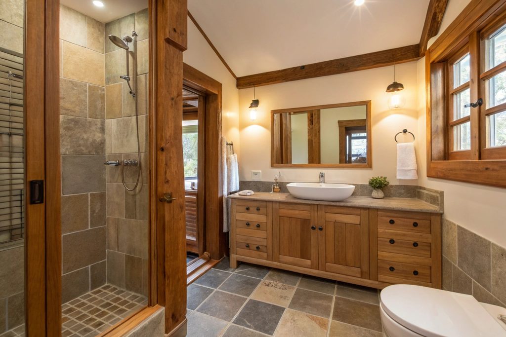 Renovated ensuite bathroom in a Hobart heritage home with timber trim and modern shower